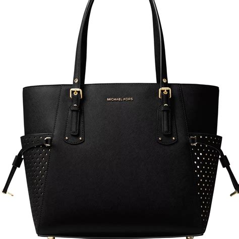 michael michael kors voyager east west leather tote|michael kors voyager signature tote.